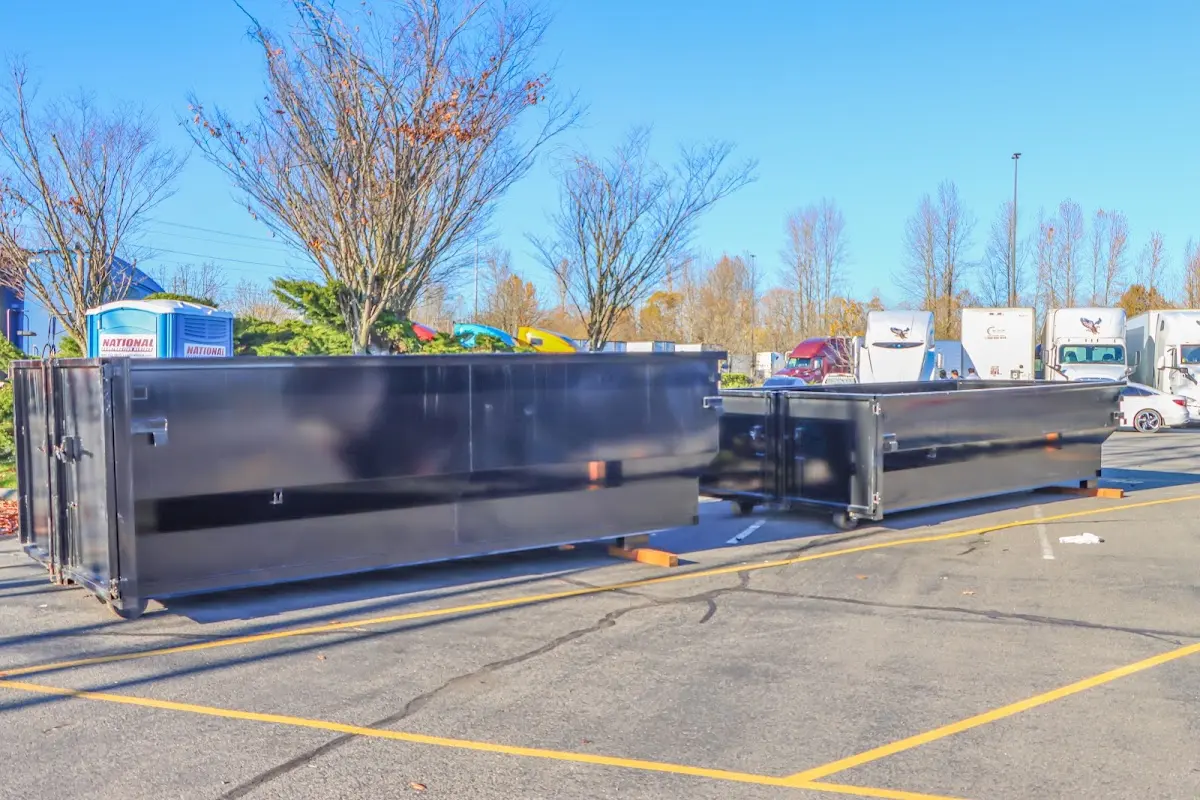 Professional dumpster rental service with roll-off container on residential driveway in Sausalito